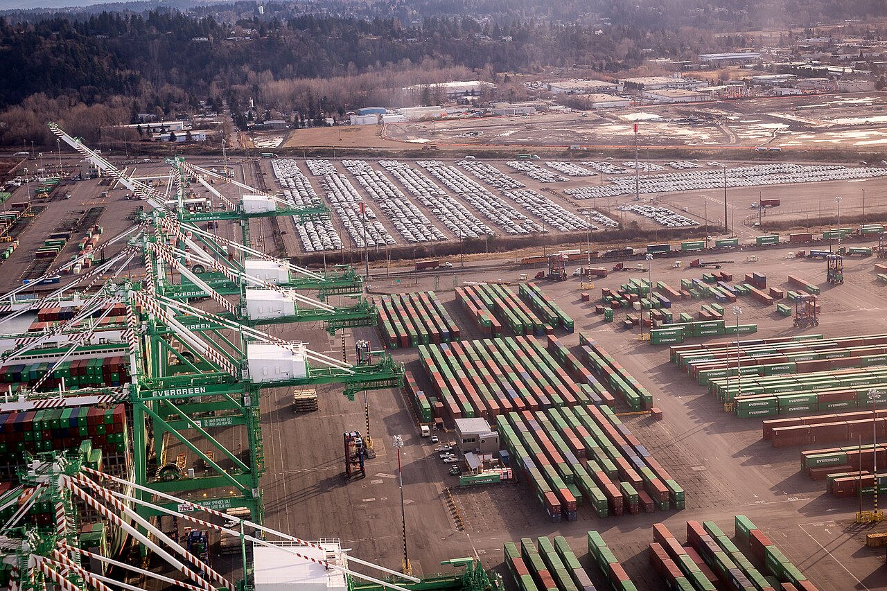 Aerial view of a shipping container port, evoking orchestrated containerized infrastructure